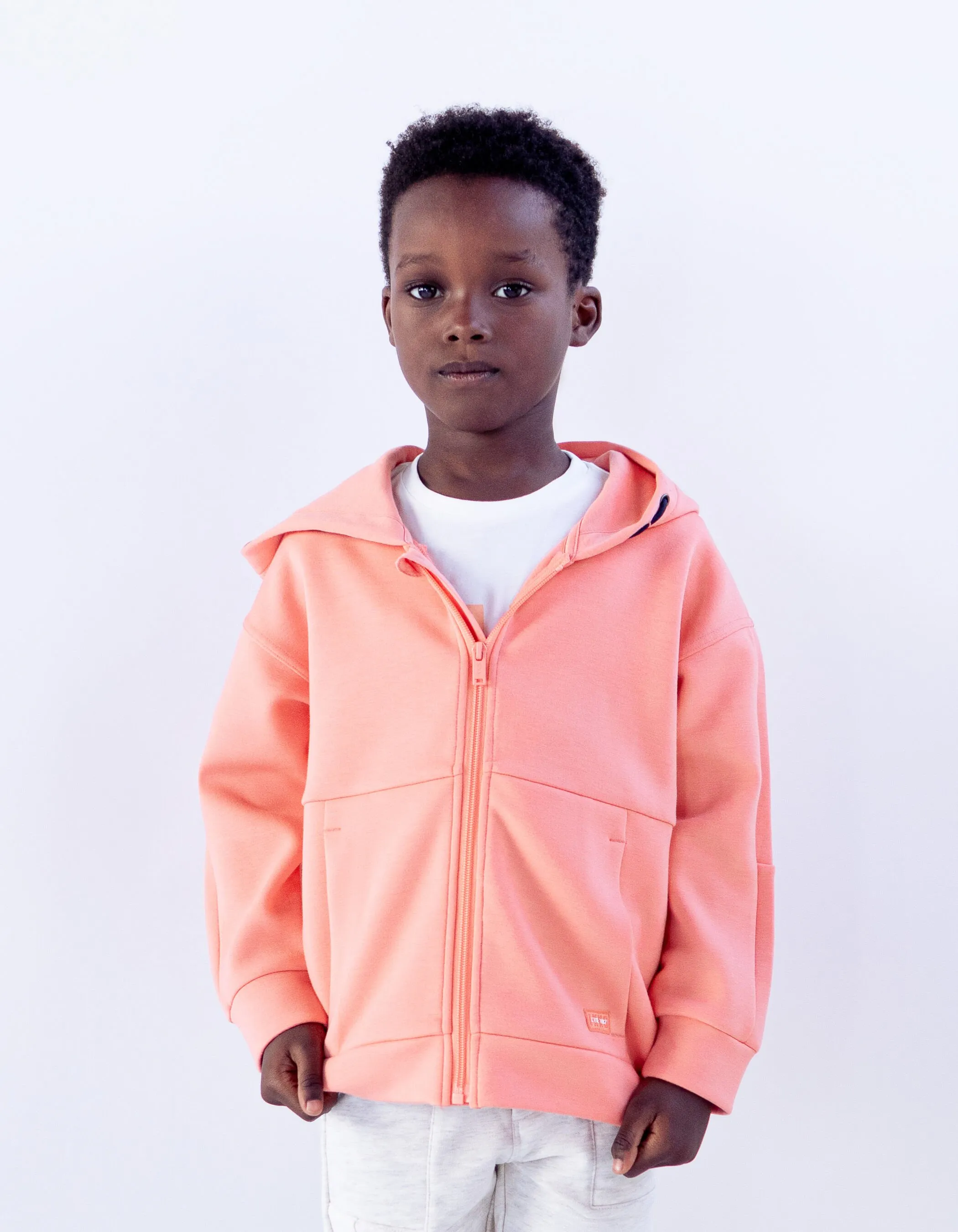 Cardigan orange fluo damier embossé dos garçon