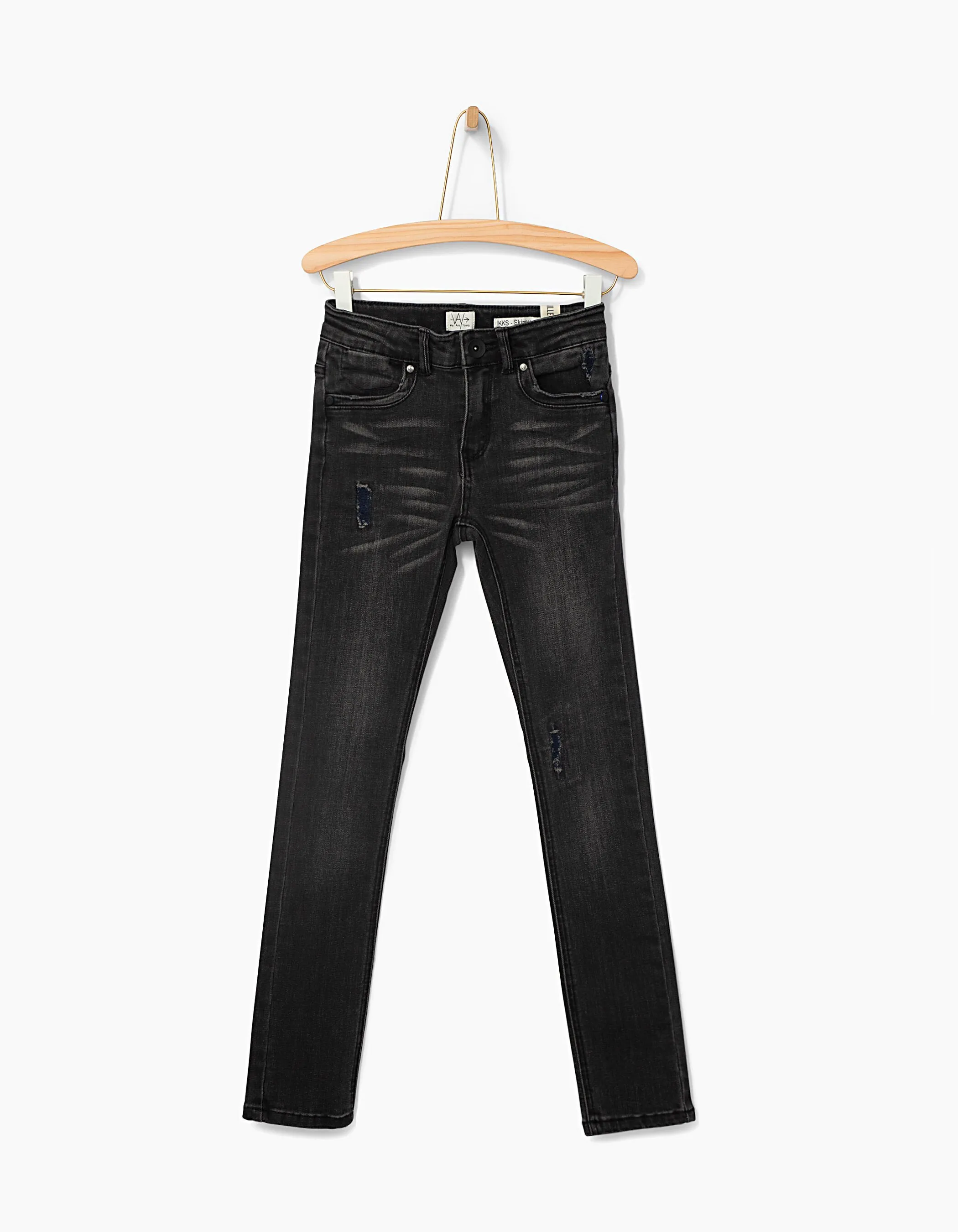 Jean skinny noir délavé à usures garçon